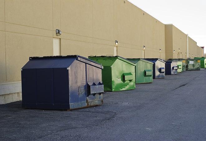 large roll-off dumpsters prepared for construction waste in Dix Hills NY